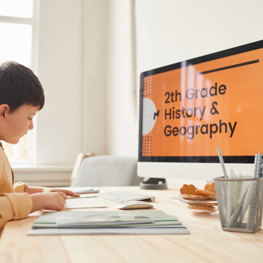 young boy doing school work on computer