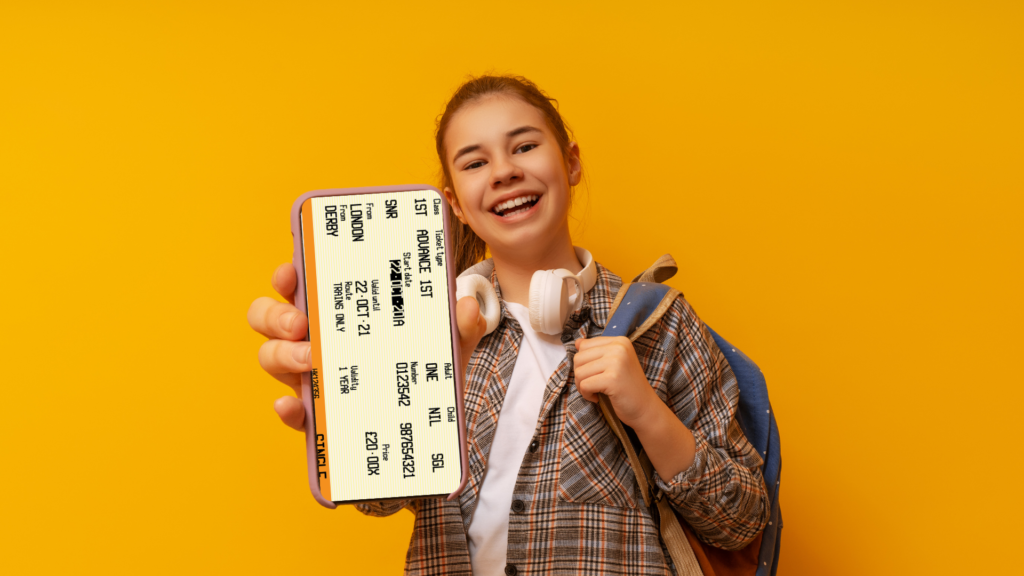 pre teen girls showing her travel ticket on her phone